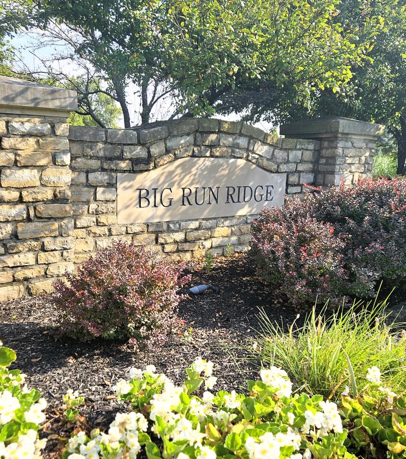 Big Run Ridge stone entrance wall with mature plantings