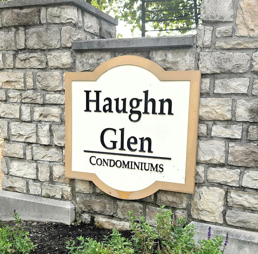 Haughn Glen Condominiums sign mounted on a stone pillar